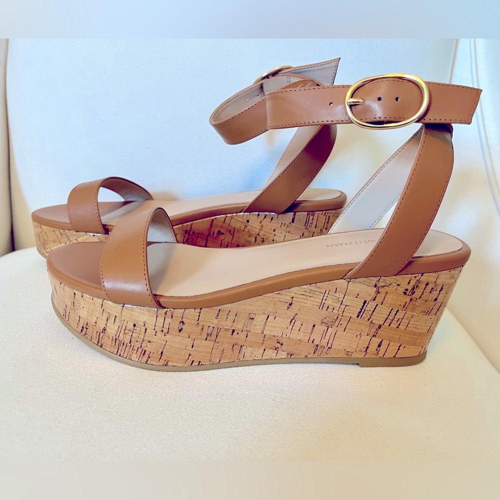 Brand new, never worn in original box. These platform sandals are gorgeous!